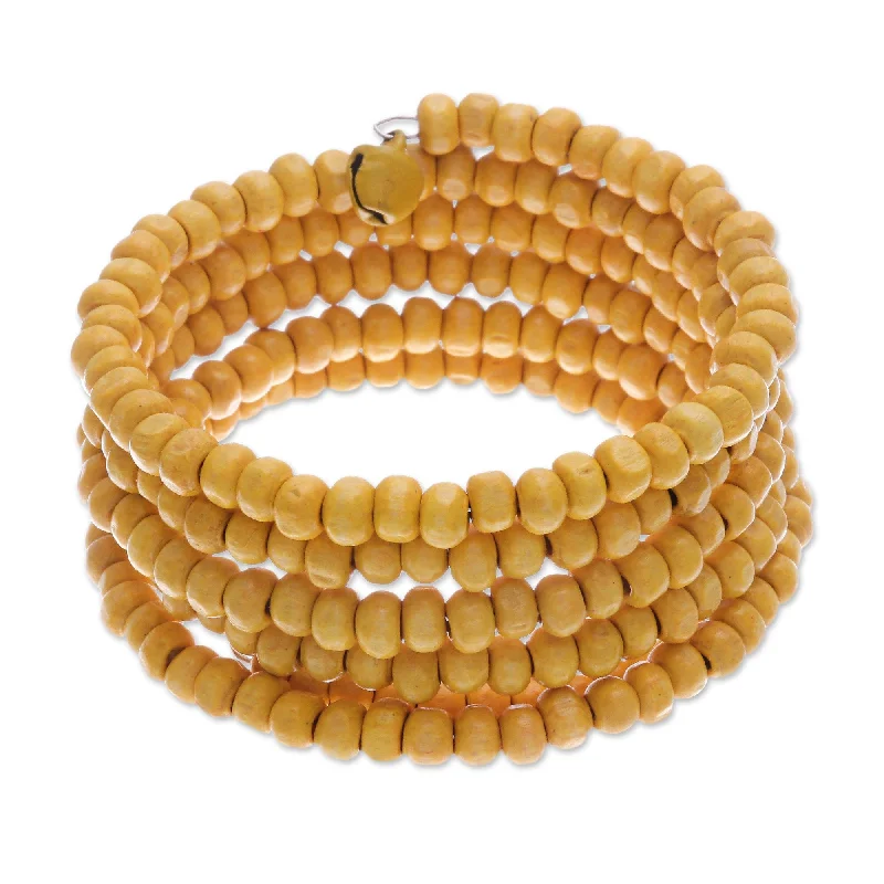 floral-inspired chain bracelet-Novica Handmade Sunshine Spin Wood Beaded Wrap Bracelet (1 In)