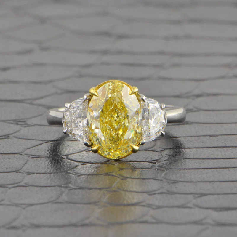 furrowed silver ring-Fancy Light Yellow Oval Cut Diamond Ring in Platinum